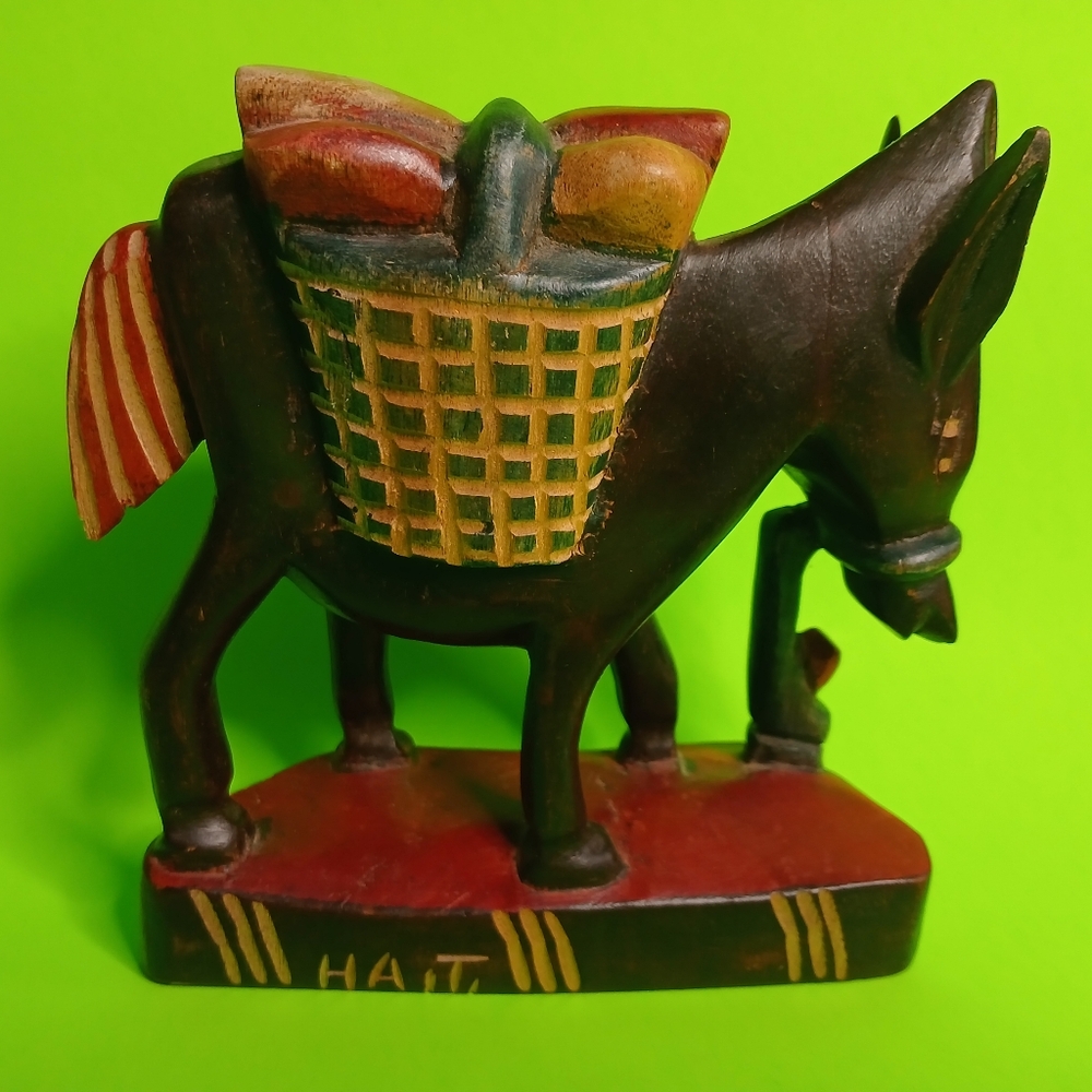 Vintage hand carved and hand painted Haiti burro donkey carrying a basket figuri